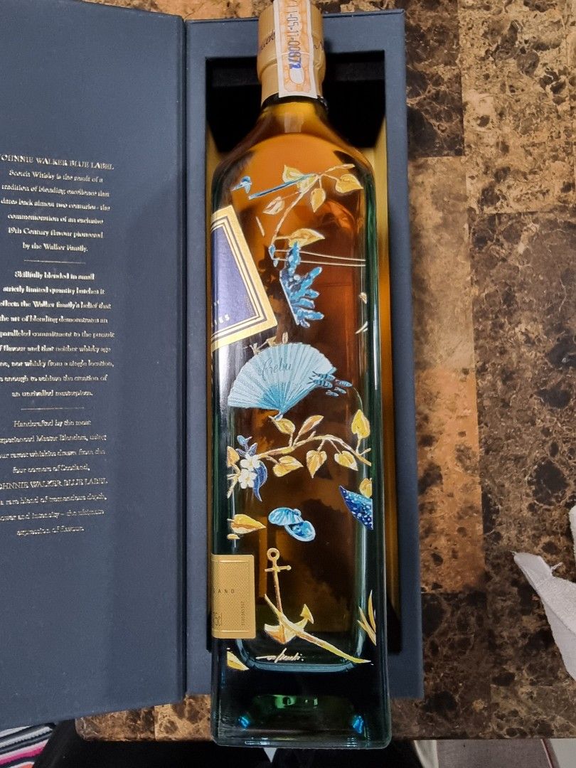 Johnnie Walker Blue Label Limited Edition Cebu (Category: Beverages) located in Caloocan City. Submitted by brydgreat (Listing ID 1411211560, Image 2). Description: Johnnie Walker Blue Label limited edition bottle. The bottle features intricate artwork. It comes in a presentation box. The box has a dark blue exterior with text on the inside..