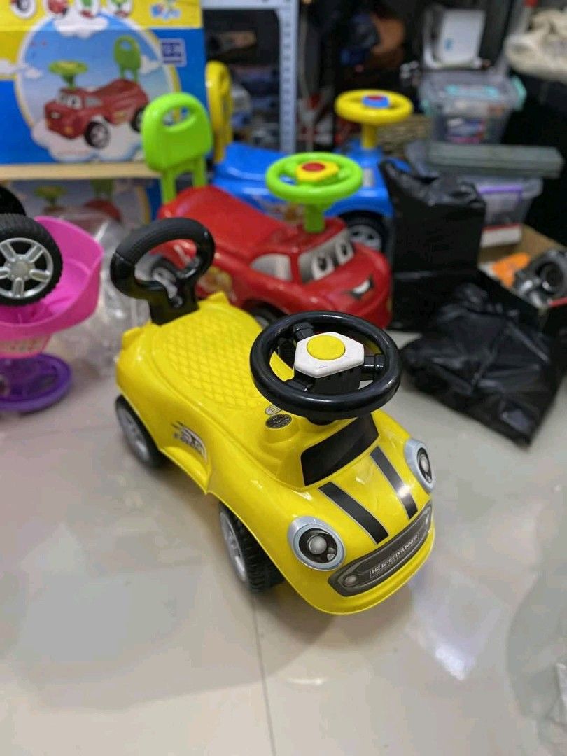 Kids Ride-on Car (Category: Babies & Kids Fashion) located in Caloocan City. Submitted by youngdog_7a3ee7 (Listing ID 1411249717, Image 3). Description: - Ride-on car for toddlers - Available colors: Pink, Yellow, Orange, Red, Blue - Features a steering wheel - Includes a push handle - Price: ₱1,199.00.