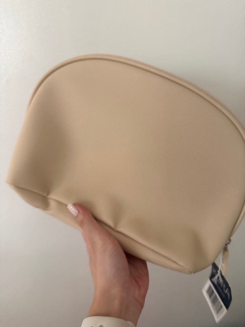 Kora Organics Cosmetic Bag (Category: Makeup) located in Taguig. Submitted by secondlifeph (Listing ID 1411121619, Image 3). Description: - Brand new Kora Organics cosmetic bag - Features a stylish beige exterior - Secure zip closure - Eye-catching patterned interior lining - Interior design includes colorful floral and fruit patterns - Comes with original tag attached MOP: Gcash, BDO, BPI, Metrobank NO MEET UP. Buyer pays first before pick up ad