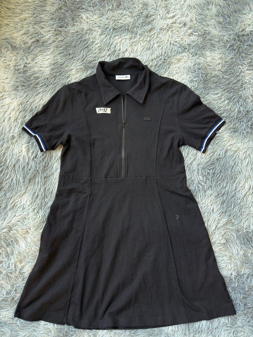 Lacoste Black Dress (Category: Dresses) located in Legazpi City. Submitted by tiny0509 (Listing ID 1411169429, Image 1). Description: - Black Lacoste dress - Size 42 - Collared neckline - Zipper closure - Short sleeves with blue and white trim - Lacoste logo on chest - Fitted bodice - Flared skirt.