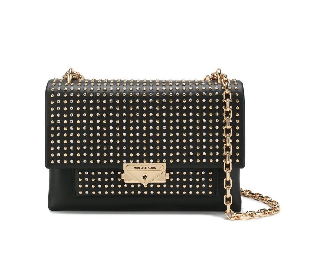Michael Kors Cece Studded Shoulder sling Bag (Category: Luxury Bags & Wallets) located in Dasmarinas. Submitted by berrylove_preloved (Listing ID 1411187315, Image 1). Description: - Black Michael Kors shoulder bag - Gold-tone hardware and studded detailing - Chain strap - Flap closure with Michael Kors logo - Interior zippered pocket - Includes dust bag.