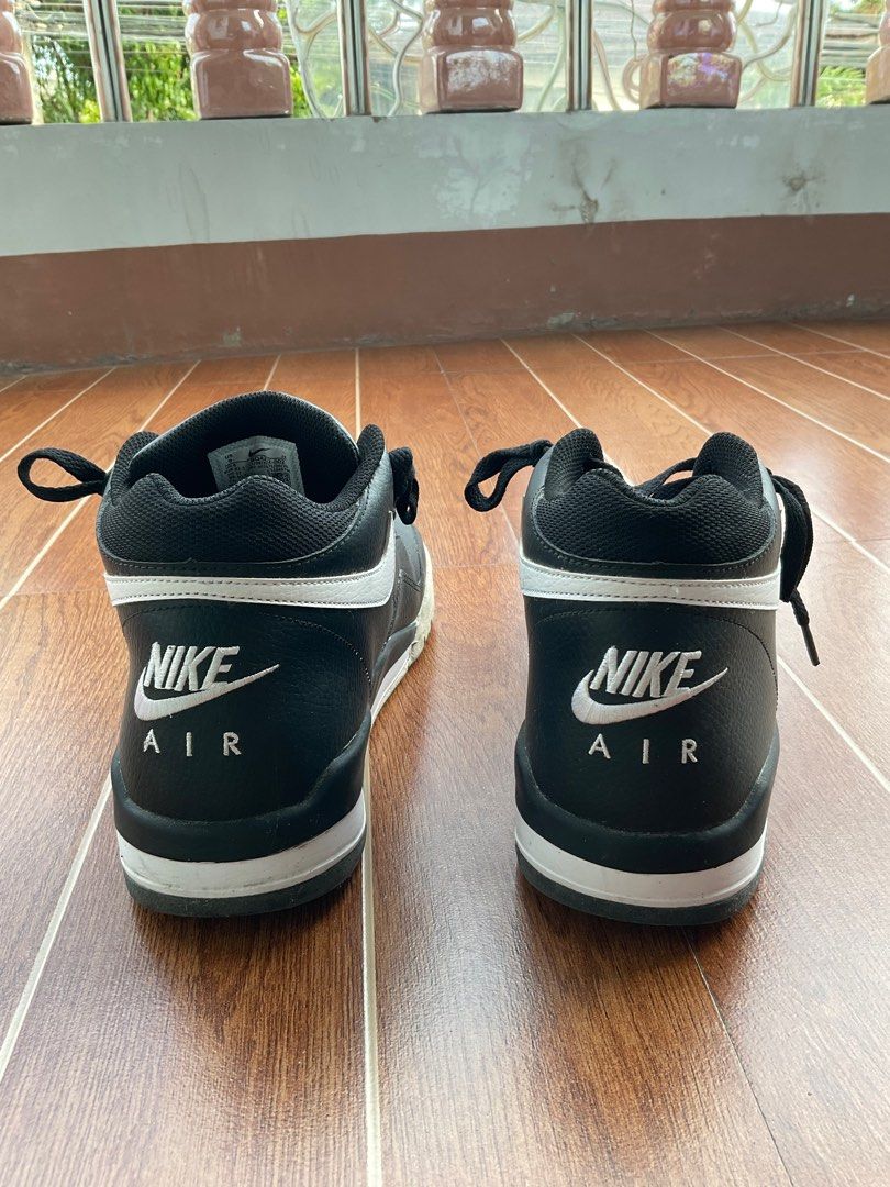 Nike Air Flight High Top Sneakers (Category: Sneakers) located in Tarlac. Submitted by nootactive (Listing ID 1411088832, Image 1). Description: Black and white Nike Air Flight high-top sneakers. Features the Nike Air logo on the back and the Nike swoosh on the sides. The size tag is visible in one of the images. The sneakers have black laces..