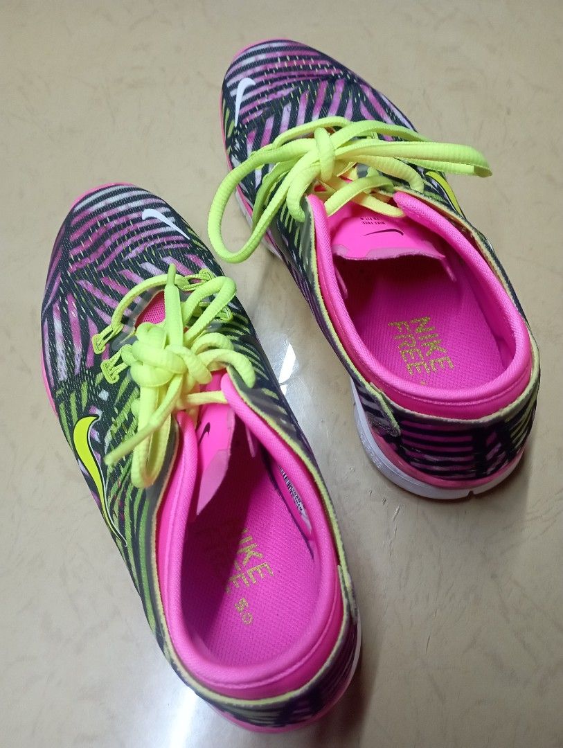 Nike Free 5.0 Women's Running Shoes (Category: Sneakers) located in Meycauayan. Submitted by issasvillaflores (Listing ID 1411157803, Image 1). Description: Nike Free 5.0 running shoes for women. Features a vibrant pink, black, and yellow color scheme. The shoes have a flexible sole and a breathable upper. The size is UK 3, EUR 36.5, and US 6. Made in Vietnam..