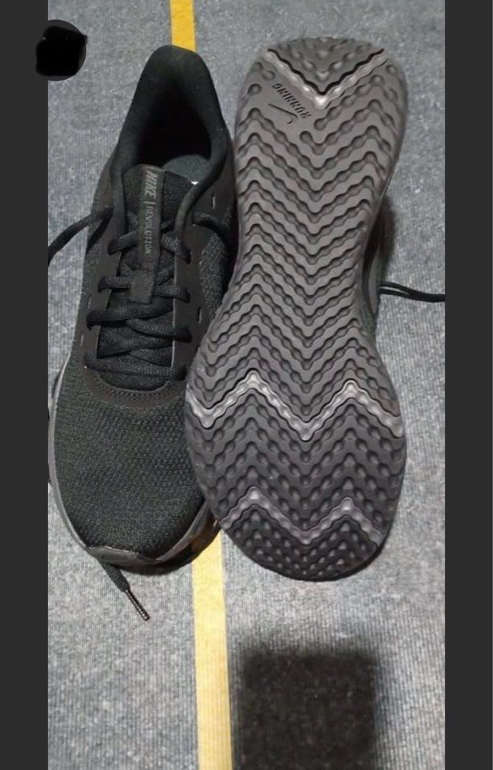 Nike Revolution Black Running Shoes (Category: Sneakers) located in Manila. Submitted by geroasc (Listing ID 1411165897, Image 3). Description: - Black Nike Revolution running shoes - Breathable mesh upper - Secure lace-up closure - Durable rubber sole - Nike logo detail.