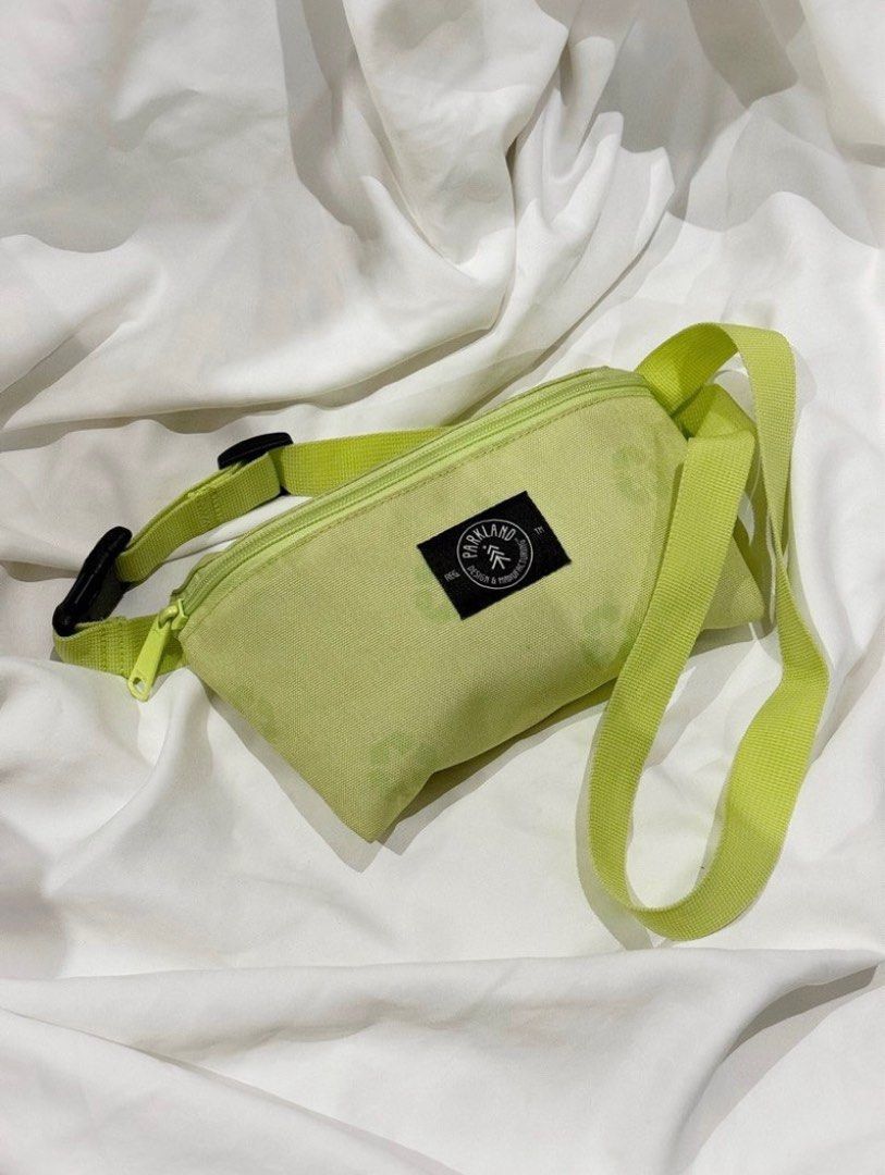 Parkland Fanny Pack - Green (Category: Belt bags, Clutches and Pouches) located in Del Monte. Submitted by popcornreport (Listing ID 1411088204, Image 1). Description: - Parkland fanny pack - Vibrant green color - Matching strap and zipper - Rectangular shape - Small logo patch - Adjustable strap - Perfect for carrying essentials.