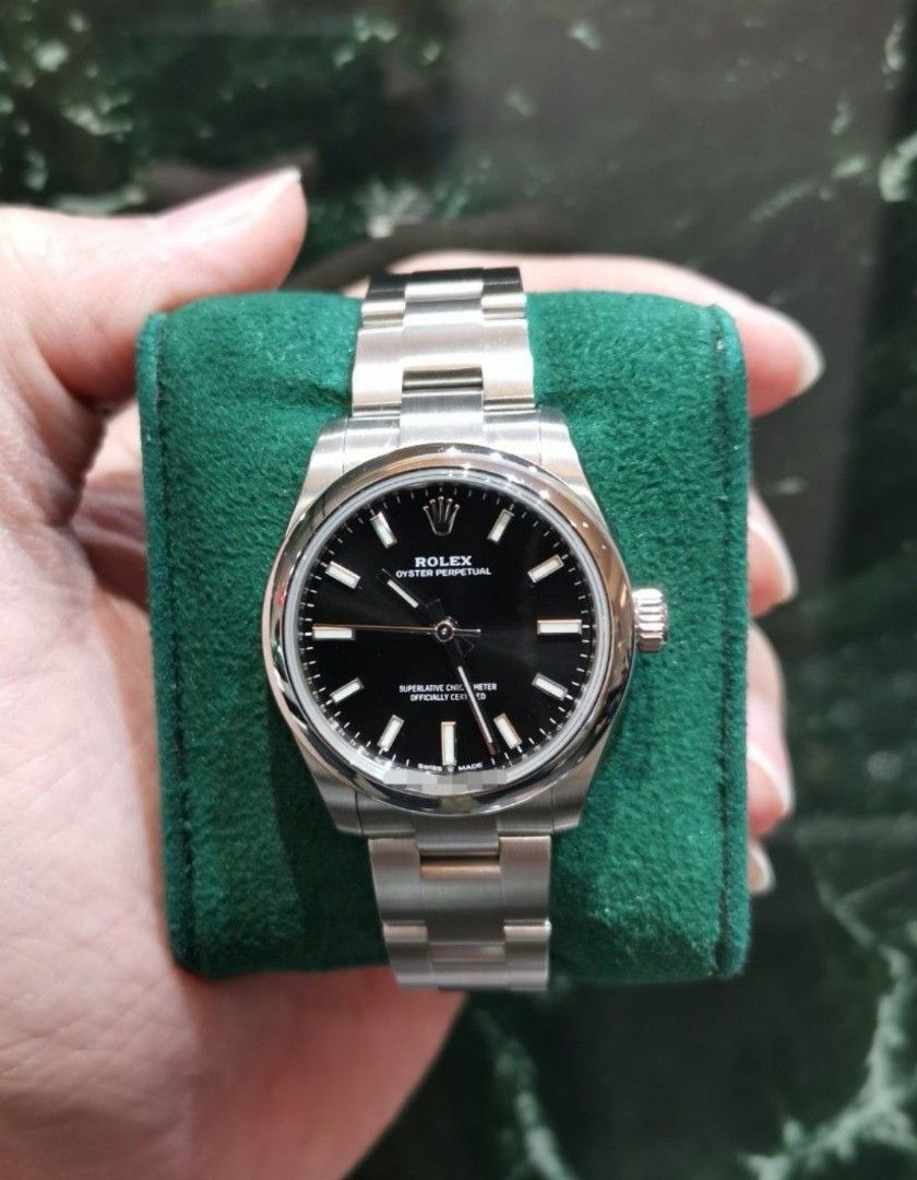 Rolex Oyster perpetual OP31 black dial oyster 277200 (Category: Watches) located in Singapore. Submitted by hengwatch (Listing ID 1411191301, Image 1). Description: Rolex Oyster perpetual OP 31mm black dial oyster Model number 277200 Brand new unworn Comes with box and cert dated June 2025 With white hang tag with matching serial number Selling for $8950 Hsbc and standard chartered and dbs and uob and ocbc ipp available 6 /12/24 months OCBC 36 mo