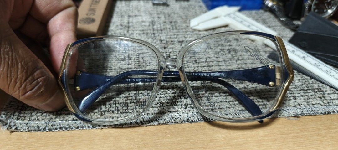 Silhouette Eyeglasses Made in Austria (Category: Sunglasses & Eyewear) located in Polomolok. Submitted by dkljapansurplus (Listing ID 1411197846, Image 1). Description: - Navy blue frame with gold accents - Made in Austria from japan - May grado kunti, as is nalang - May kunting gasgas sa lenses - Measurements: 51 [] 17 135.