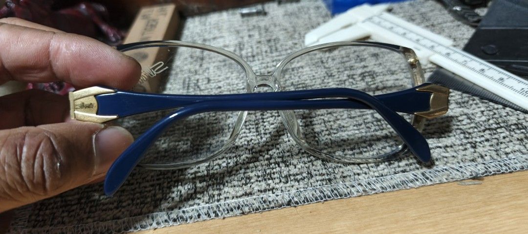 Silhouette Eyeglasses Made in Austria (Category: Sunglasses & Eyewear) located in Polomolok. Submitted by dkljapansurplus (Listing ID 1411197846, Image 2). Description: - Navy blue frame with gold accents - Made in Austria from japan - May grado kunti, as is nalang - May kunting gasgas sa lenses - Measurements: 51 [] 17 135.