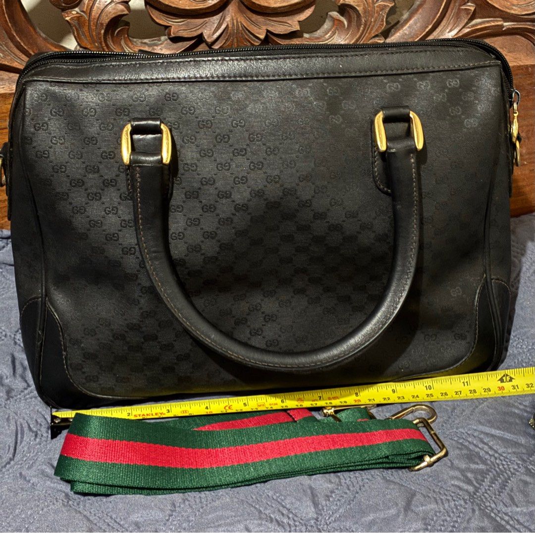 Vintage Gucci Black Micro GG Handbag with Strap (Category: Luxury Bags & Wallets) located in Quezon City. Submitted by exvintagecollector (Listing ID 1411096417, Image 2). Description: - Authentic Gucci handbag -Vintage 70's - Iconic micro GG pattern - Gold-tone hardware - Detachable green and red striped shoulder strap (generic) - Top zipper closure - Single interior zippered pocket - Dark fabric interior lining - Gucci logo on the front no more