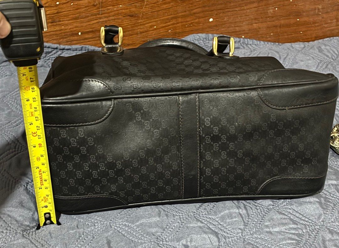 Vintage Gucci Black Micro GG Handbag with Strap (Category: Luxury Bags & Wallets) located in Quezon City. Submitted by exvintagecollector (Listing ID 1411096417, Image 3). Description: - Authentic Gucci handbag -Vintage 70's - Iconic micro GG pattern - Gold-tone hardware - Detachable green and red striped shoulder strap (generic) - Top zipper closure - Single interior zippered pocket - Dark fabric interior lining - Gucci logo on the front no more