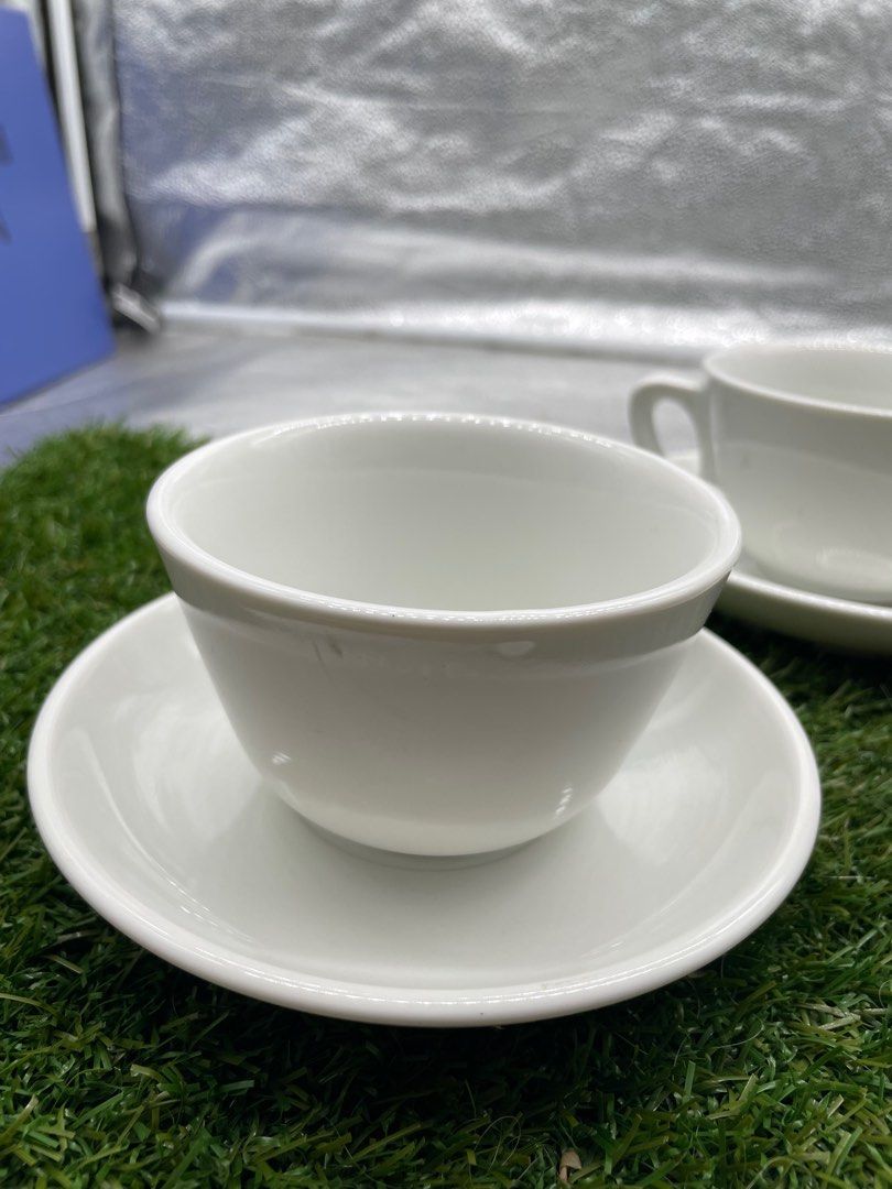 White Tea Cup and Saucer Set (Category: Coffee & Tea Tableware) located in Quezon City. Submitted by eilgaraje (Listing ID 1411244876, Image 3). Description: Set of four white tea cups with matching saucers. The saucers measure approximately 10cm in diameter. The cups appear to be a standard size. Perfect for enjoying tea or coffee. A simple and elegant addition to your kitchen or dining table..
