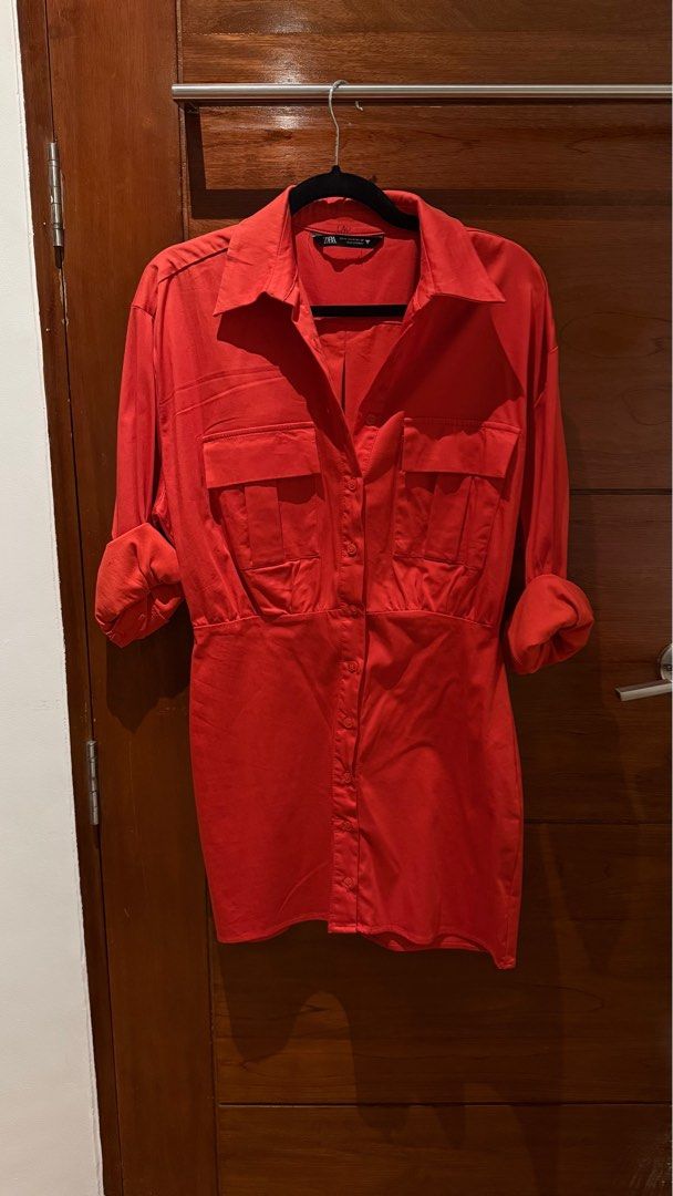 Zara Red Shirt Dress (Category: Dresses) located in Cainta. Submitted by alesells (Listing ID 1411215802, Image 3). Description: - Zara shirt dress - Vibrant red color - Size M - Collared neckline - Long sleeves with buttoned cuffs - Two front pockets - Fitted waist - Button-down front closure.