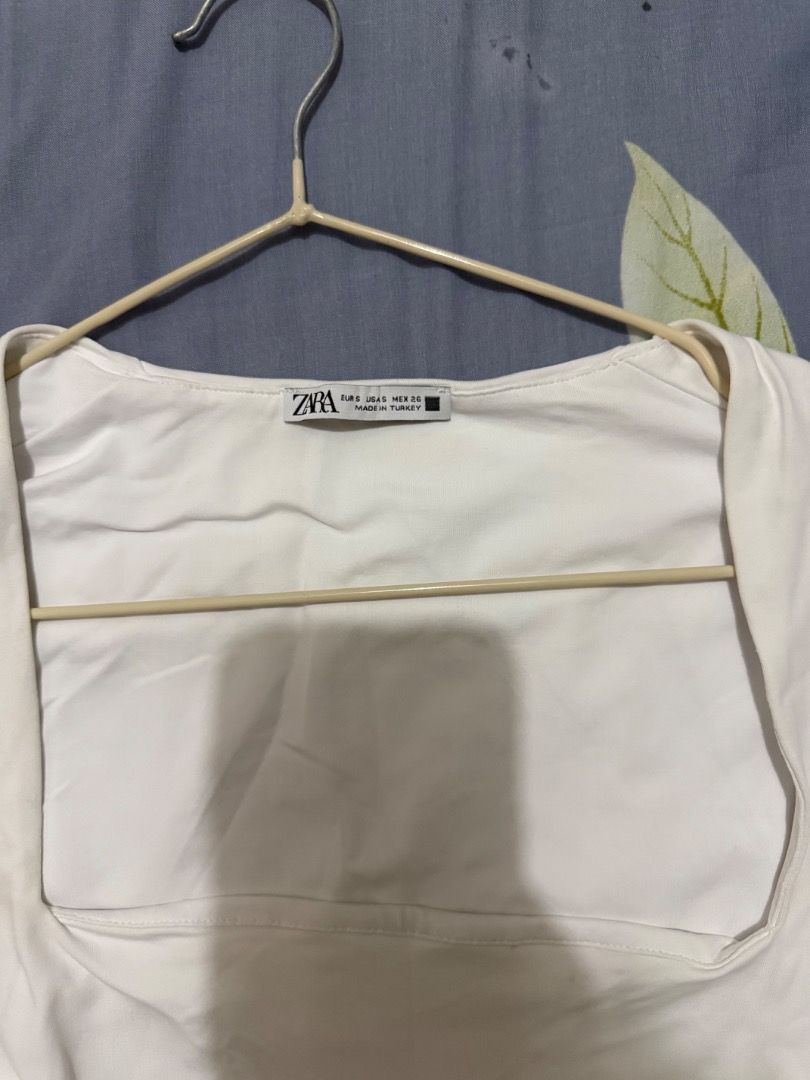 Zara Square Neck Bodysuit (Category: Others Tops) located in Valenzuela. Submitted by raquesells (Listing ID 1411149160, Image 2). Description: - Zara white bodysuit - Square neckline - yellow stains due to storage - never worn, not my style .