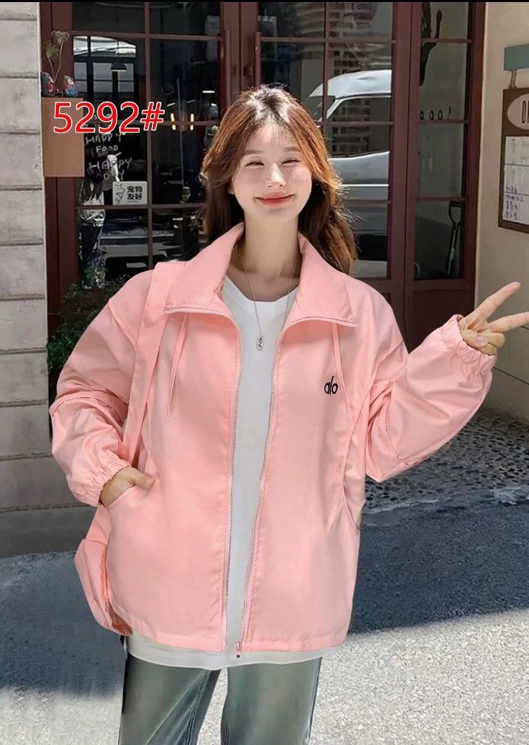 Alo Lightweight Jacket (Category: Coats, Jackets and Outerwear) located in Manila. Submitted by rocillocin64338 (Listing ID 1411392141, Image 2). Description: - Alo Lightweight Jacket - Zip-up front - Side pockets - Small logo on chest - Available Colors: Black, Pink, White, Beige, Gray, Red - Relaxed fit - Collared neckline - Lightweight material (possibly nylon).