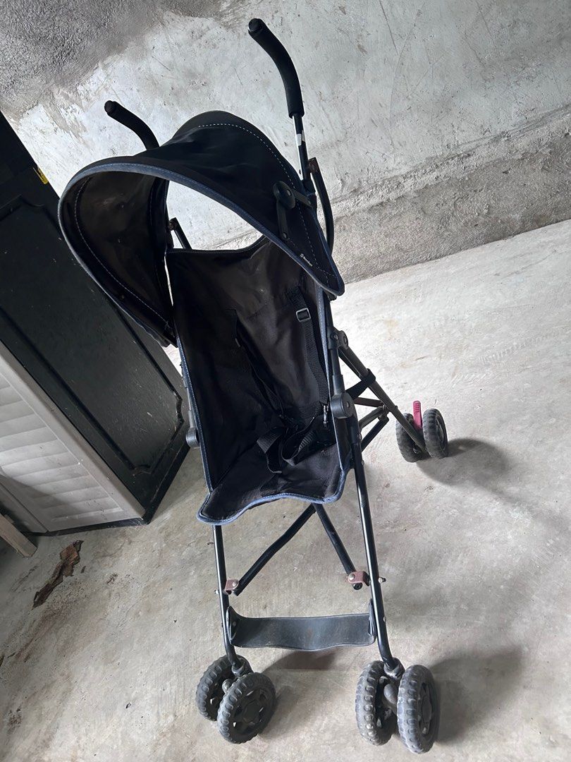 Black Stroller (Category: Strollers) located in Agdangan. Submitted by lyo_13 (Listing ID 1411421327, Image 2). Description: - Black stroller - Suitable for young children - Includes sunshade - Features safety harness - Four wheels - Foldable for easy storage - Durable fabric seat - Black frame.