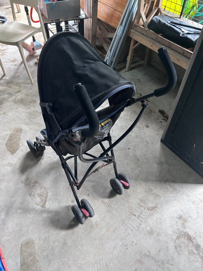 Black Stroller (Category: Strollers) located in Agdangan. Submitted by lyo_13 (Listing ID 1411421327, Image 3). Description: - Black stroller - Suitable for young children - Includes sunshade - Features safety harness - Four wheels - Foldable for easy storage - Durable fabric seat - Black frame.