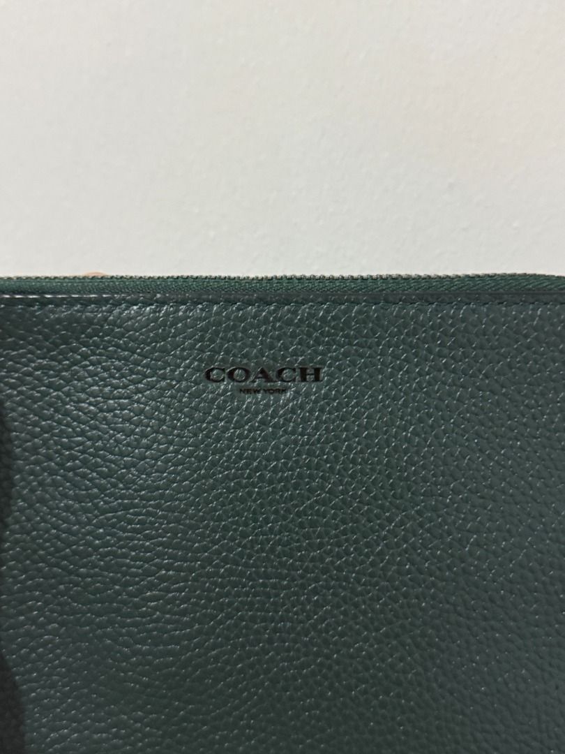 Coach Corner Zip Wristlet - Dark Green (Category: Luxury Bags & Wallets) located in Quezon City. Submitted by afpar (Listing ID 1411361814, Image 2). Description: - Dark green Coach wristlet - Zip closure - Includes wrist strap - Green interior - Made of leather - Coach logo on front - Got in Singapore.