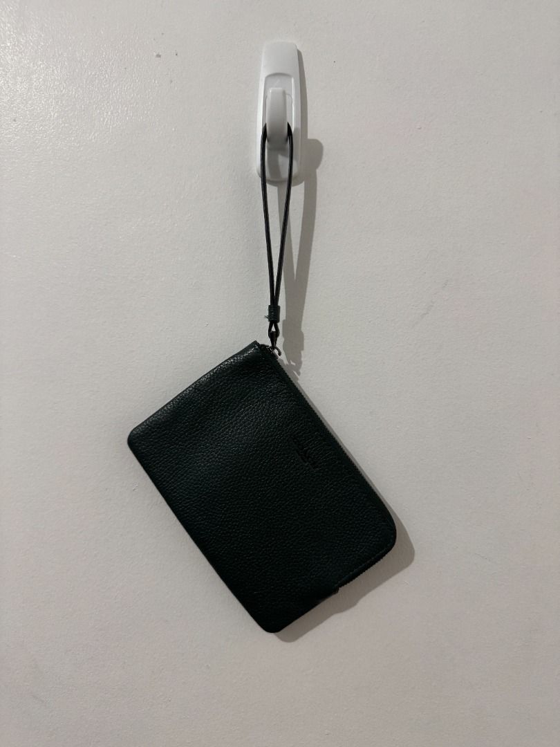 Coach Corner Zip Wristlet - Dark Green (Category: Luxury Bags & Wallets) located in Quezon City. Submitted by afpar (Listing ID 1411361814, Image 1). Description: - Dark green Coach wristlet - Zip closure - Includes wrist strap - Green interior - Made of leather - Coach logo on front - Got in Singapore.