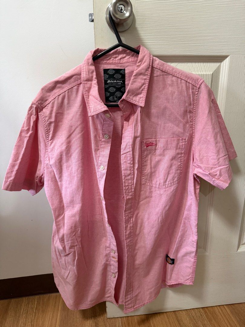 Dickies Short Sleeve Polo - Pink (Category: Tshirts & Polo Shirts ) located in Santo Tomas. Submitted by bjmitrav11 (Listing ID 1411345919, Image 1). Description: - Dickies pink short-sleeved shirt - Size: Large - Features a chest pocket with Dickies logo - Button-down front and collar - Made of woven fabric - Minor stain on the front MOP: GCASH.