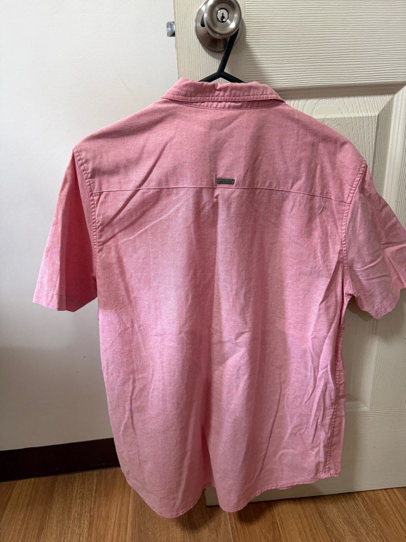 Dickies Short Sleeve Polo - Pink (Category: Tshirts & Polo Shirts ) located in Santo Tomas. Submitted by bjmitrav11 (Listing ID 1411345919, Image 2). Description: - Dickies pink short-sleeved shirt - Size: Large - Features a chest pocket with Dickies logo - Button-down front and collar - Made of woven fabric - Minor stain on the front MOP: GCASH.