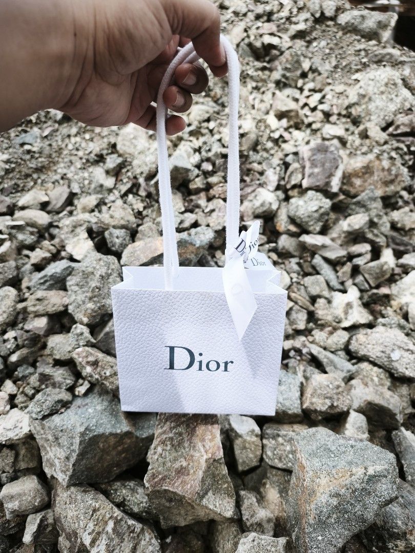 Dior Paper Gift Bag (small) (Category: Luxury Bags & Wallets) located in Digos. Submitted by emmanuel28 (Listing ID 1411442323, Image 2). Description: Dior Paper Gift Bag small size with Dior Ribbon Authentic from Japan Good as new Location: Davao del Buyer shoulders shipping fee.