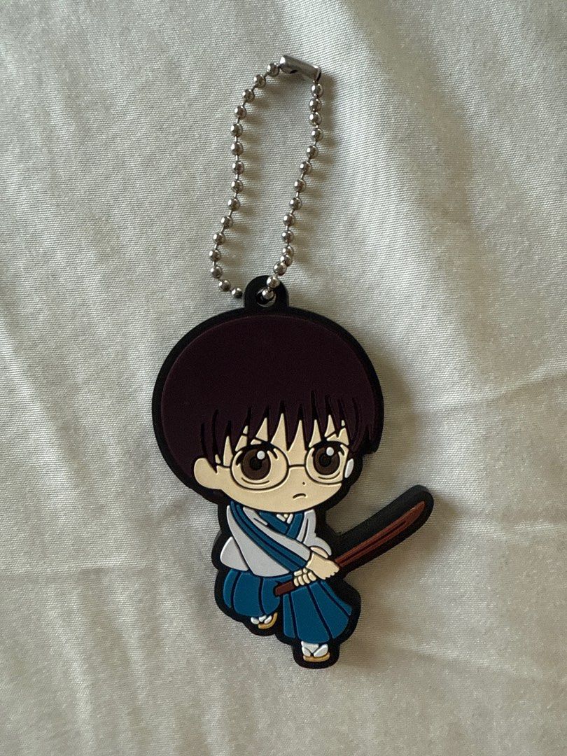 GINTAMA anime Shinpachi Keychain (Category: Character Goods) located in Mandaluyong City. Submitted by merisellsyouwhat (Listing ID 1411350467, Image 1). Description: - GINTAMA Shinpachi keychain - Includes chain for easy attachment - Made of rubber - Back text: ©S/STDBA B.JAPAN 2735917 Fr Japan gashapon.