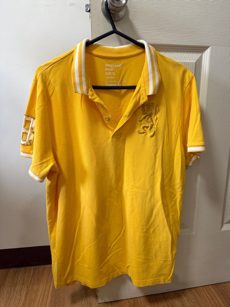 Giordano Yellow Polo Shirt XL (Category: Tshirts & Polo Shirts ) located in Santo Tomas. Submitted by bjmitrav11 (Listing ID 1411344621, Image 1). Description: - Giordano yellow polo shirt - Size: XL - Collared neckline - Short sleeves with white trim - Lion emblem on chest - Button-up placket - Plain yellow back MOP: GCash.