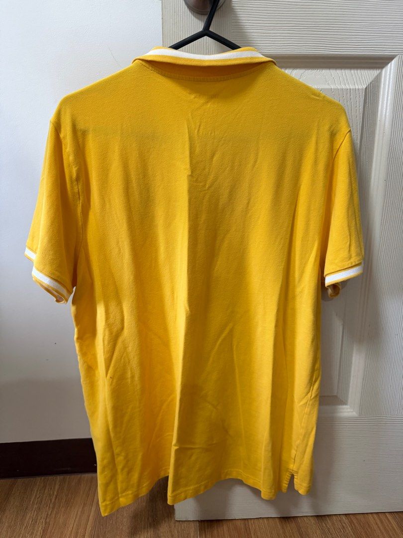 Giordano Yellow Polo Shirt XL (Category: Tshirts & Polo Shirts ) located in Santo Tomas. Submitted by bjmitrav11 (Listing ID 1411344621, Image 2). Description: - Giordano yellow polo shirt - Size: XL - Collared neckline - Short sleeves with white trim - Lion emblem on chest - Button-up placket - Plain yellow back MOP: GCash.