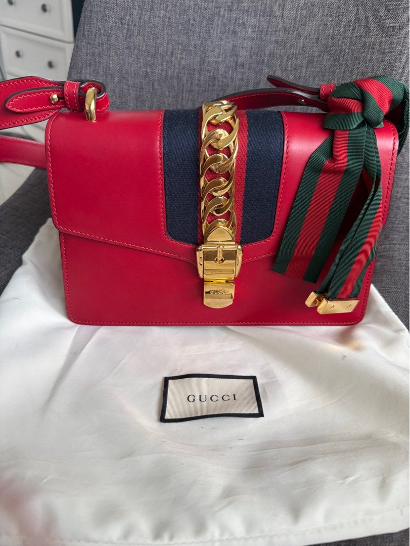 Gucci Sylvie Shoulder Bag (Category: Luxury Bags & Wallets) located in Cebu City. Submitted by kathy.molina (Listing ID 1411389508, Image 1). Description: - Red leather handbag - Gold-tone clasp and hardware - Structured shape with flap closure - Interior zippered pocket - Includes dust bag - Authenticity cards included *** comes wid dustbag, care cards and box ***.
