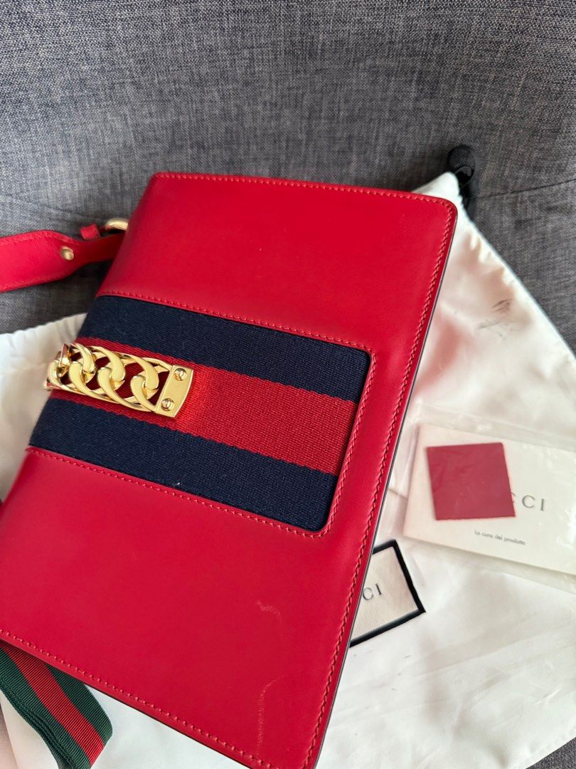 Gucci Sylvie Shoulder Bag (Category: Luxury Bags & Wallets) located in Cebu City. Submitted by kathy.molina (Listing ID 1411389508, Image 2). Description: - Red leather handbag - Gold-tone clasp and hardware - Structured shape with flap closure - Interior zippered pocket - Includes dust bag - Authenticity cards included *** comes wid dustbag, care cards and box ***.