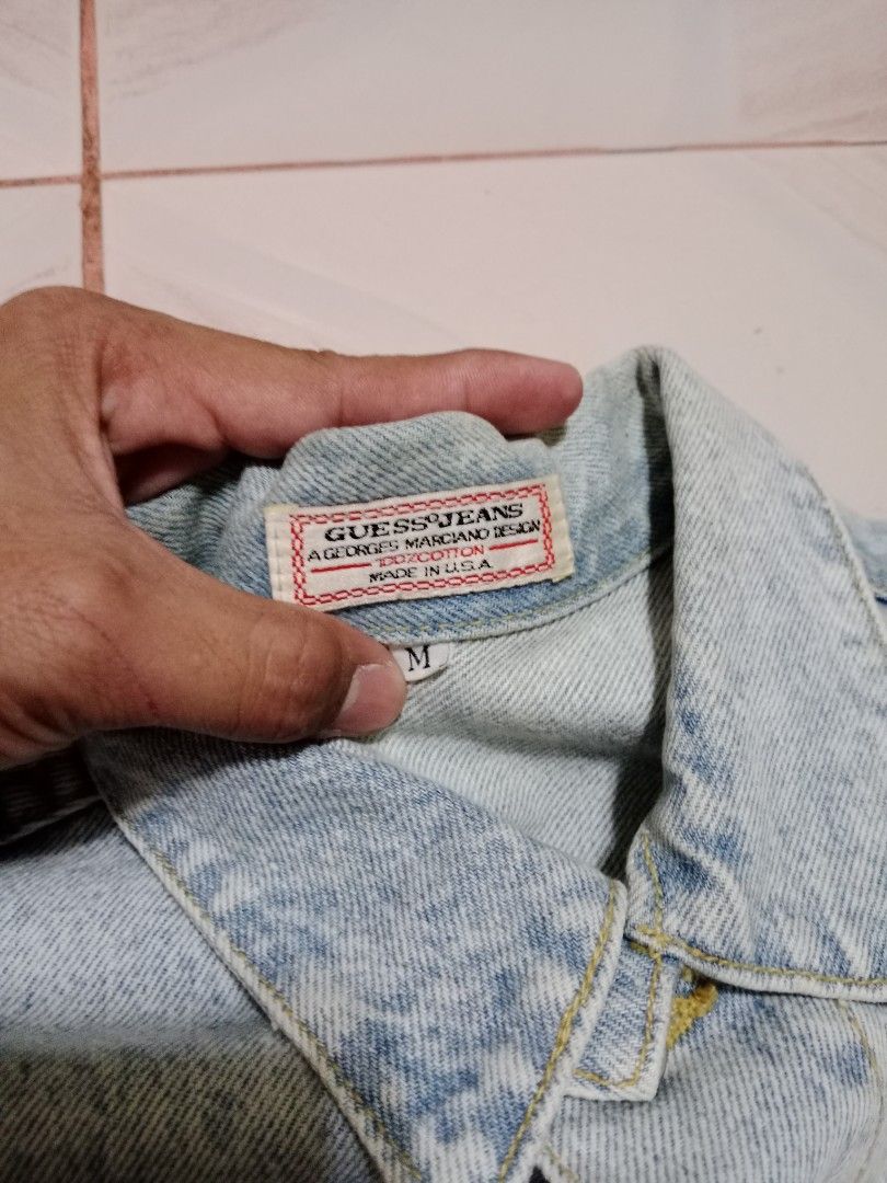 Guess Jeans Acid Wash Denim Jacket (Category: Coats, Jackets and Outerwear) located in Calauan. Submitted by vntg.bless (Listing ID 1411423231, Image 3). Description: - Authentic Guess denim jacket - Acid wash design - Button-up closure - Multiple pockets - Guess logo detail - Made in USA - Size M - Dimes 21.7x25.