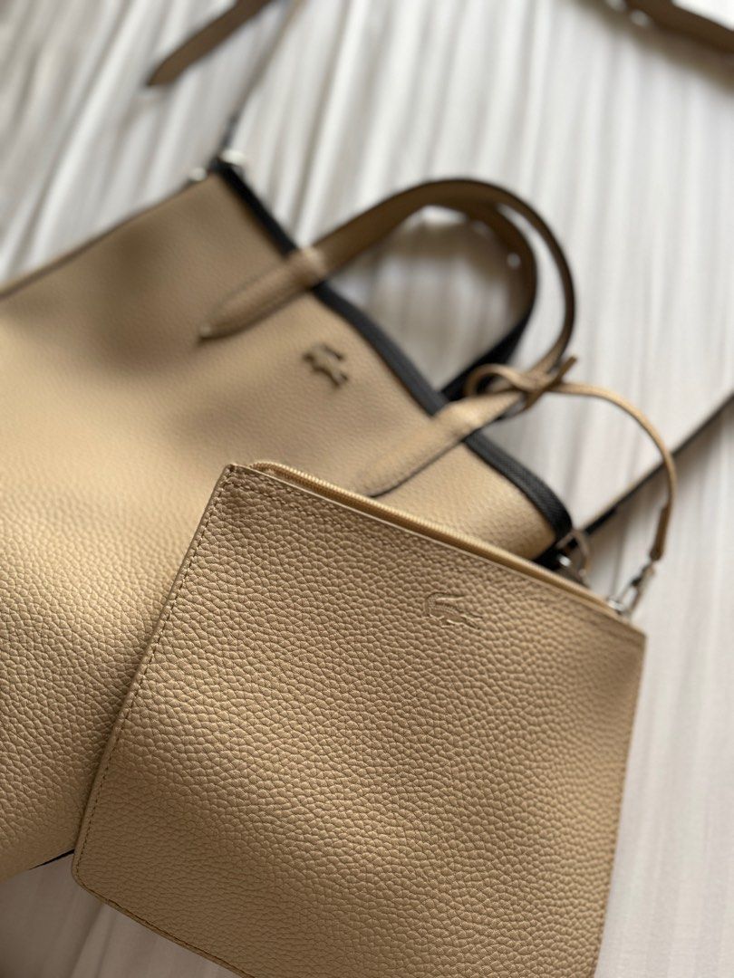 Lacoste Anna Reversible Vertical Tote Bag with detachable pouch (Category: Tote Bags) located in Pasig City. Submitted by abbyrds (Listing ID 1411351663, Image 3). Description: - Reversible Lacoste tote bag - Authentic or money back - Includes a matching beige pouch with zipper closure - Comes with a shoulder strap - Lacoste logo on both bag and pouch RFS: decluttering .