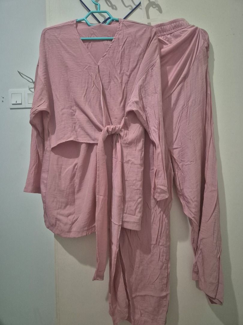 Lilit maternity top and pants (Category: Sets or Coordinates) located in Kuala Lumpur. Submitted by normizs (Listing ID 1411281714, Image 1). Description: - Two-piece outfit in soft pink. - V-neck top with tie detail. - Long-sleeved top and matching pants. - Lightweight and comfortable fabric. - Perfect for casual wear..