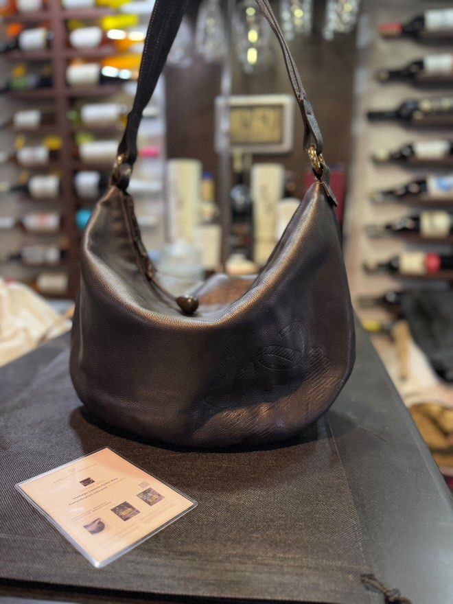 Loewe Vintage Hobo Bag (Category: Luxury Bags & Wallets) located in Taguig. Submitted by norie.m (Listing ID 1411270363, Image 3). Description: Location: Taguig with authenticity certificate - Authentic Loewe vintage hobo bag - Dark brown leather exterior - Curved design - Single shoulder strap - Gold-tone hardware - Patterned interior lining - Includes LegitGrails authenticity certificate.