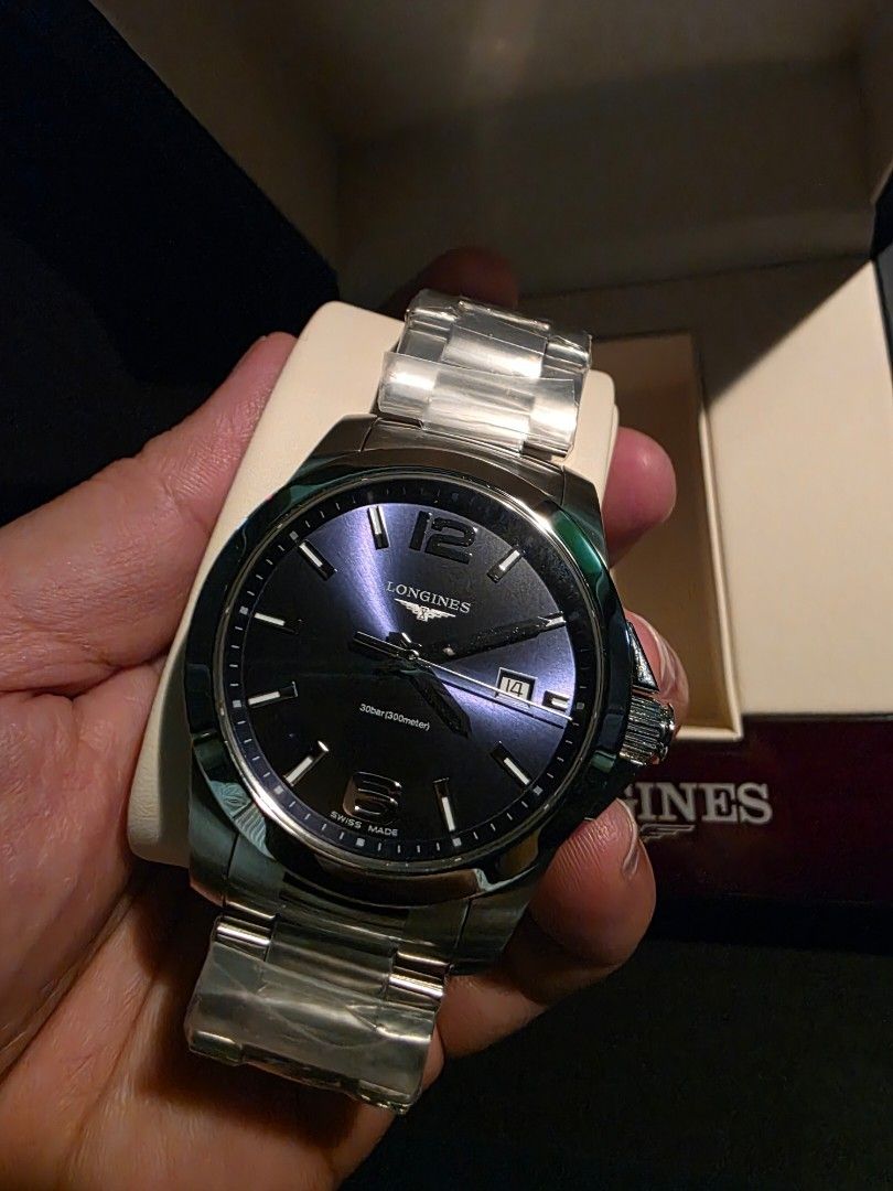 Longines Conquest Watch (Category: Luxury Watches) located in Manila. Submitted by iantrepreneuer (Listing ID 1411437393, Image 1). Description: - Longines Conquest watch -Quartz -41mm - Striking blue dial - Stainless steel bracelet - Includes original box and warranty card - Protective film on bracelet Foreign AD: Purchased December 2025 Selling below SRP, original price is 53,000php.