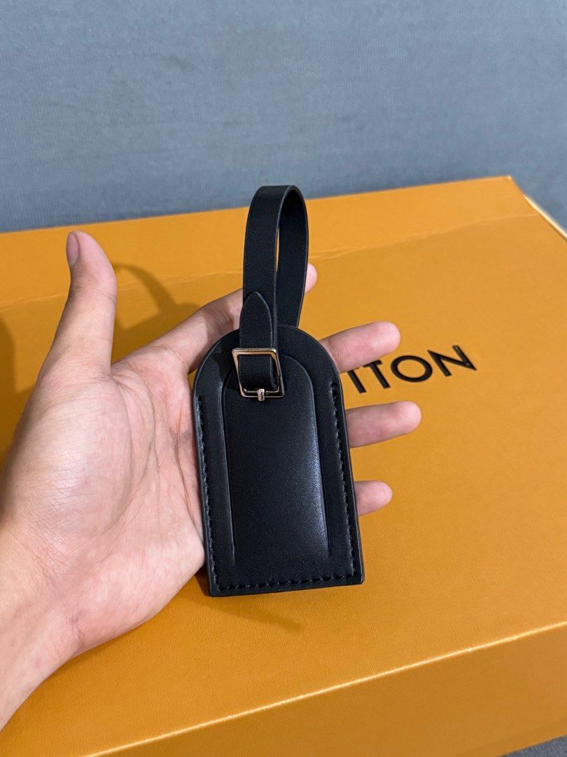 Louis Vuitton Black Leather Duffle Bag (Category: Luxury Bags & Wallets) located in Manila. Submitted by royal.prono (Listing ID 1411410985, Image 3). Description: - Louis Vuitton duffle bag - Black leather - Detachable shoulder strap included - Comes with luggage tag - Original box included - Silver-tone hardware - Includes original receipts and paperwork - Stylish and practical travel bag.