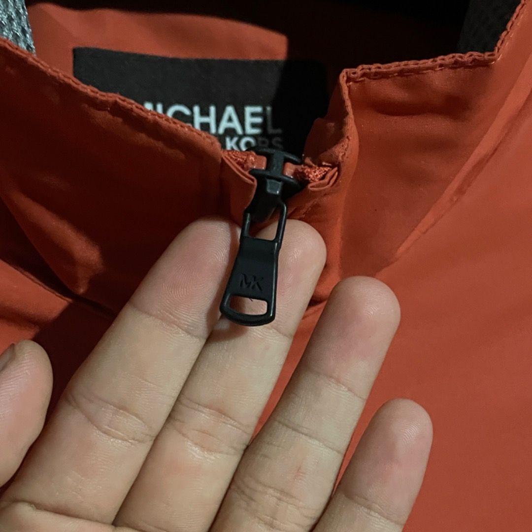 Michael Kors Water-Resistant Windbreaker Jacket (Category: Coats, Jackets and Outerwear) located in Bacolod City. Submitted by caast.archives (Listing ID 1411415024, Image 3). Description: Michael Kors Water-Resistant Windbreaker Jacket Authentic Size: Large fit Condition: Excellent Flaw: None.