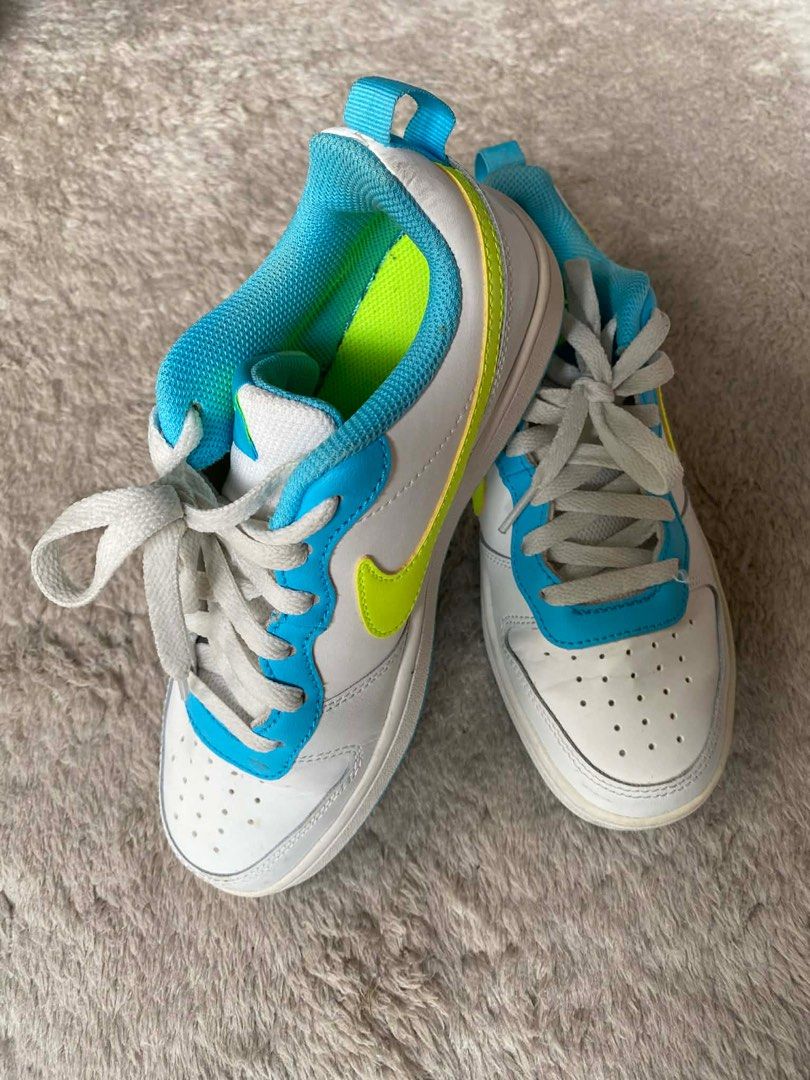 Nike Sneakers White Blue Green (Category: Sneakers) located in Mandaluyong City. Submitted by prelovedbytim (Listing ID 1411291595, Image 2). Description: - Nike sneakers for kids - White base with blue and green accents - Classic lace-up design - Padded collar for comfort - Iconic Nike swoosh.