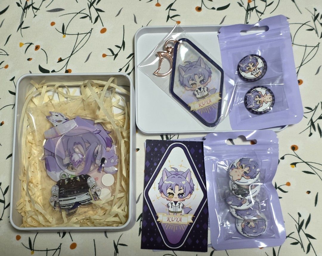 Nu carnival Gift Set with Tin Box (Category: Designer & Blind Box Toys) located in Manila. Submitted by topperware (Listing ID 1411320892, Image 2). Description: Gift set includes two tin boxes with anime character designs. Each box contains various items such as acrylic standees, keychains, buttons, and cards. One set features kuya, and the other features yakumo. Both sets appear to be complete with all original packaging. 1000 php each yakumo i