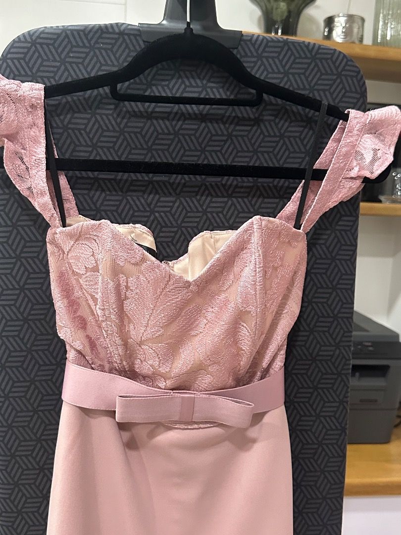 Pink Off-Shoulder Formal Dress (Category: Dresses) located in Pasig City. Submitted by angelssparecloset01 (Listing ID 1411311369, Image 3). Description: - Pink off-shoulder formal dress - Lace detailing on bodice - Fitted silhouette - Bow belt accentuates waist - Floor-length skirt - Ideal for formal events.