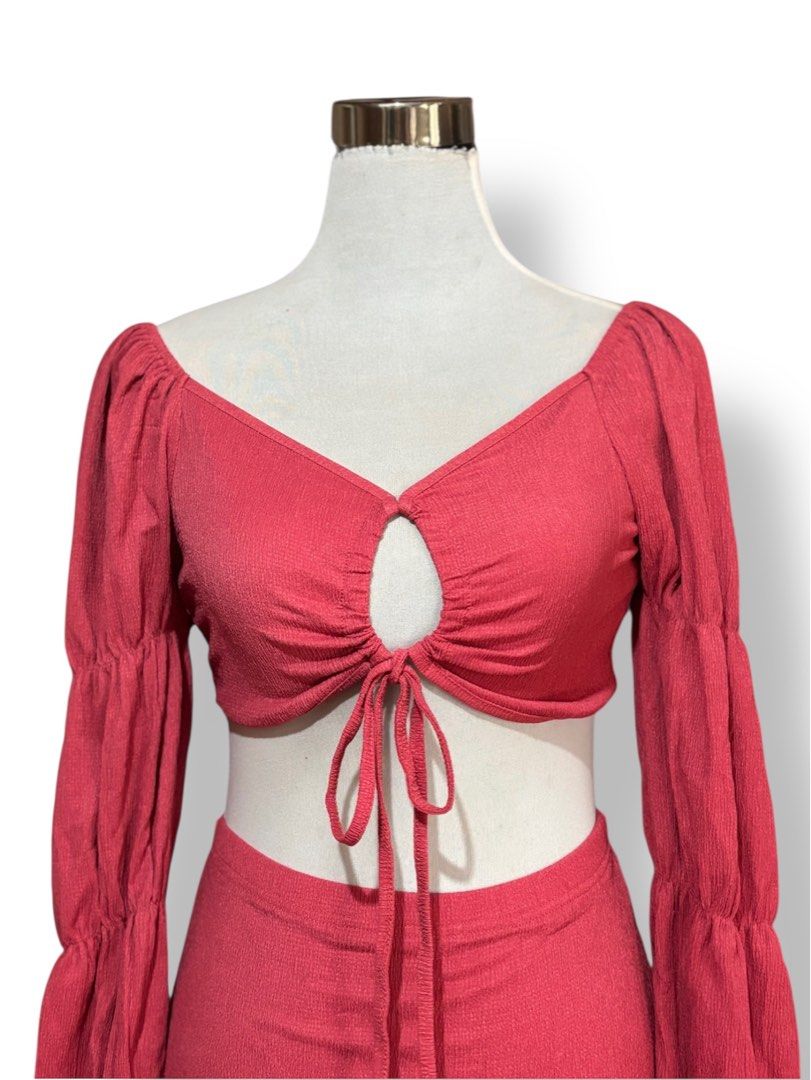 Red Crop Top and Mini Skirt Set (Category: Sets or Coordinates) located in Mati. Submitted by classicatch.ph_new (Listing ID 1411311132, Image 3). Description: BNEW Summer Terno 250 + SF Size: Small to Med - Red crop top with keyhole detail - Long, puffy sleeves - Matching mini skirt - Tie closure at the front - Ribbed fabric - Perfect for special occasions or a night out.