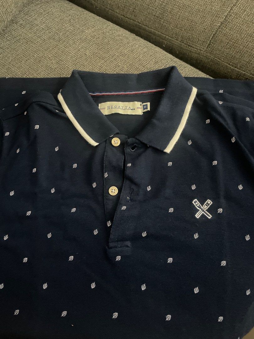 Regatta Navy Blue Polo Shirt - Medium (Category: Tshirts & Polo Shirts ) located in Meycauayan. Submitted by princessbitsandpieces (Listing ID 1411372515, Image 1). Description: - Regatta navy blue polo shirt - Size: Medium - Classic polo collar with white trim - Embroidered logo on chest - White trim on sleeves.