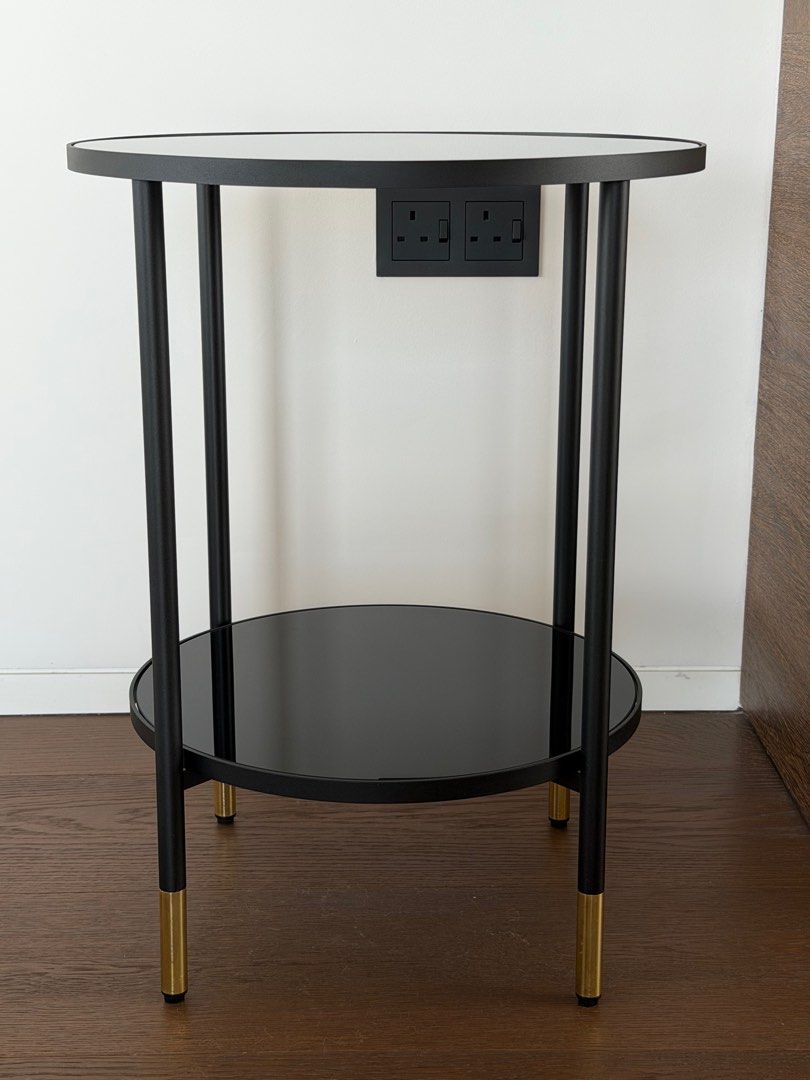 Side table classy (Category: Other Home Furniture) located in Singapore. Submitted by frau_h (Listing ID 1411428149, Image 1). Description: Black, black glass. Like new. No scratches Height: 60 cm Diameter: 45 cm Free height under furniture: 17 cm Max. load: 5 kg Max. load/shelf: 10 kg.