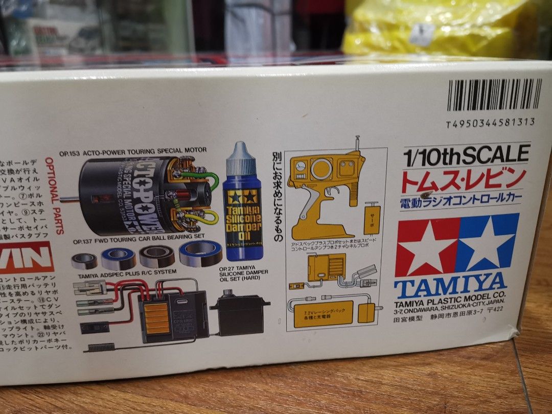 Tamiya Tom's Levin 1/10th Scale RC Car (Category: Vehicle & Diecast Models) located in Manila. Submitted by genesis11_21 (Listing ID 1411383785, Image 3). Description: - 58131 Tamiya Tom's Levin 1/10th scale RC car model kit. Chassis FF01 - Features a striking red Toyota race car design. - Includes detailed parts and components for assembly. - Box showcases the car's design and internal components. - Comes with a motor, oil, and other accessories