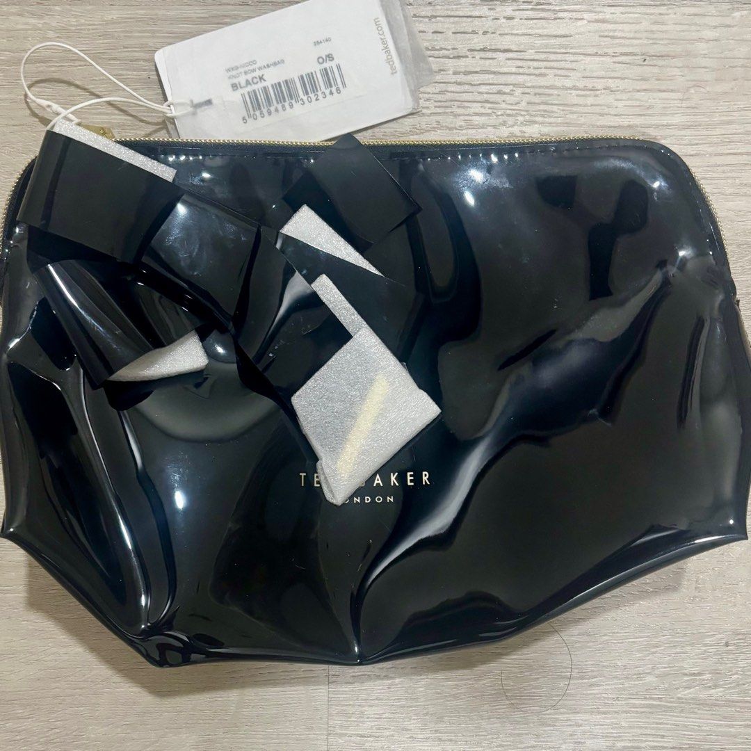 Ted Baker Nicco Knot Bow Washbag Black (Category: Clutches) located in Pasig City. Submitted by ysobelandquin (Listing ID 1411292232, Image 1). Description: Brand new Ted Baker Nicco Knot Bow Washbag Black - PhP1750 exclusive of shipping Payment via Gcash or BPI only Shipping via Grab, Lalamove, Gogoexpress at buyer’s expense .