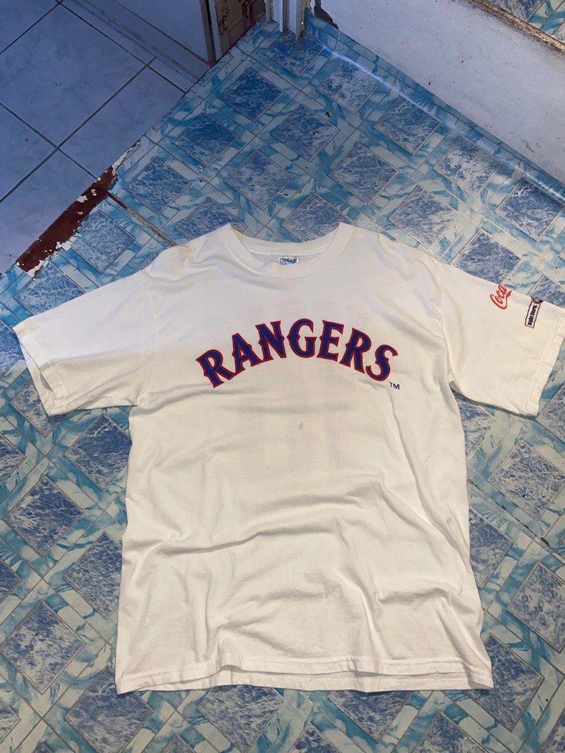 Texas Rangers Young #10 Graphic Tshirt (Category: Tshirts & Polo Shirts ) located in Navotas City. Submitted by patrickvarg (Listing ID 1411288520, Image 1). Description: L on tag 21x29 Issue: hole, lint, and minimal yellow stain.
