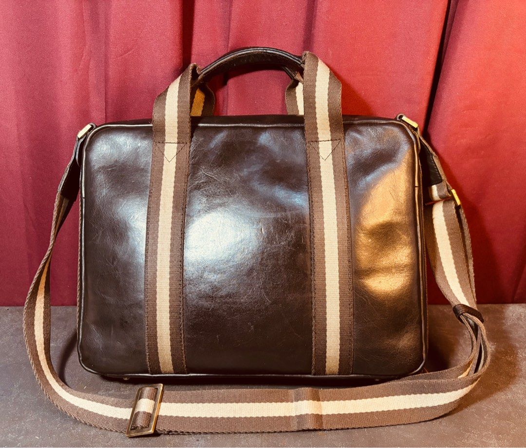 Vintage MCM Brown Leather Medium Briefcase Messenger Bag Webbed Design (Category: Luxury Bags & Wallets) located in Malabon City. Submitted by sartorial_finds (Listing ID 1411420972, Image 3). Description: Dimensions: 13”L x 10”H x 3”W, small to medium size briefcase. Can fit small laptops and electronics. Can be used either briefcase, shoulder bag or cross body bag as a messenger bag. Materials: Genuine Cowhide Leather in Brown, Webbed Design Co