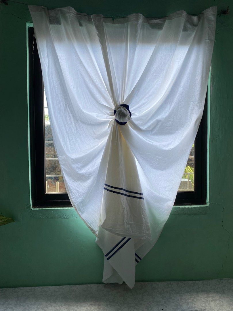 White Curtain with Blue Stripes (Category: Curtains & Blinds) located in Taguig. Submitted by indaysukaycloset (Listing ID 1411326056, Image 1). Description: - White curtain with blue stripes - Made of light fabric - Features a tie-up design - Ideal for windows -2 pcs pair .
