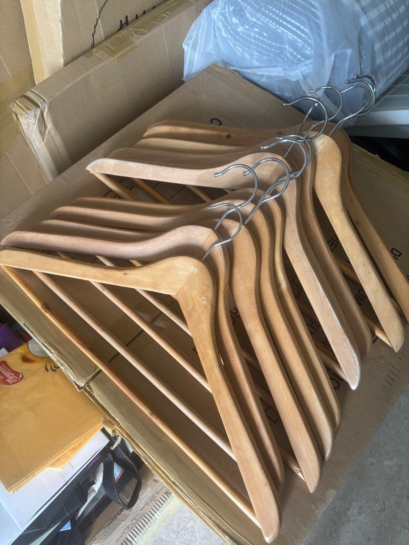 Wooden Clothes Hangers 10pcs (Category: Hooks & Hangers) located in Pasig City. Submitted by royski72 (Listing ID 1411388467, Image 2). Description: - Set of wooden clothes hangers - Natural wood finish - Metal hooks - Some hangers include a bar for pants or accessories - Keeps clothes in shape - Stylish closet organization.
