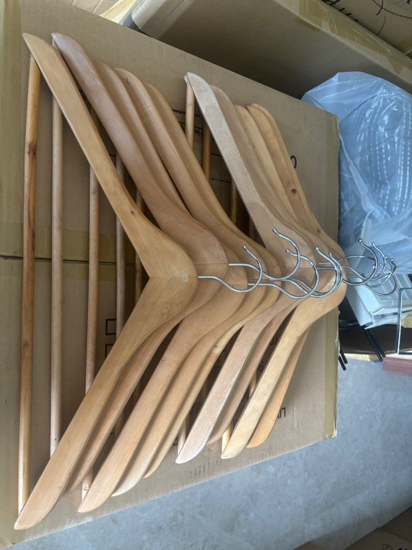 Wooden Clothes Hangers 10pcs (Category: Hooks & Hangers) located in Pasig City. Submitted by royski72 (Listing ID 1411388467, Image 1). Description: - Set of wooden clothes hangers - Natural wood finish - Metal hooks - Some hangers include a bar for pants or accessories - Keeps clothes in shape - Stylish closet organization.